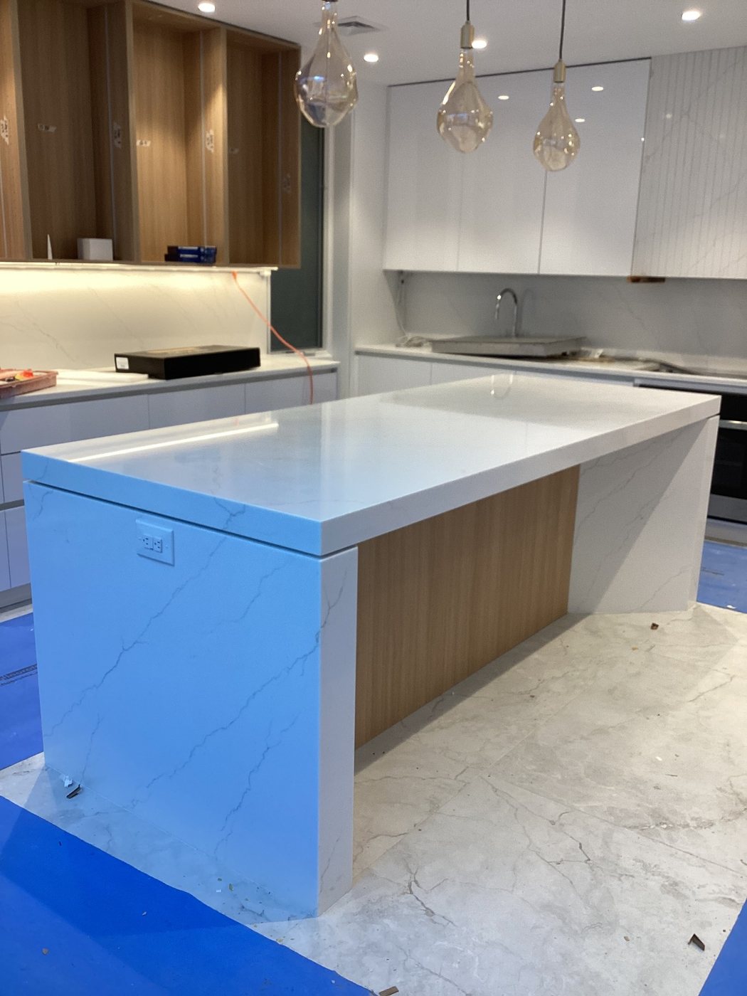 Modern Quartz Kitchen by BlueStone Creations